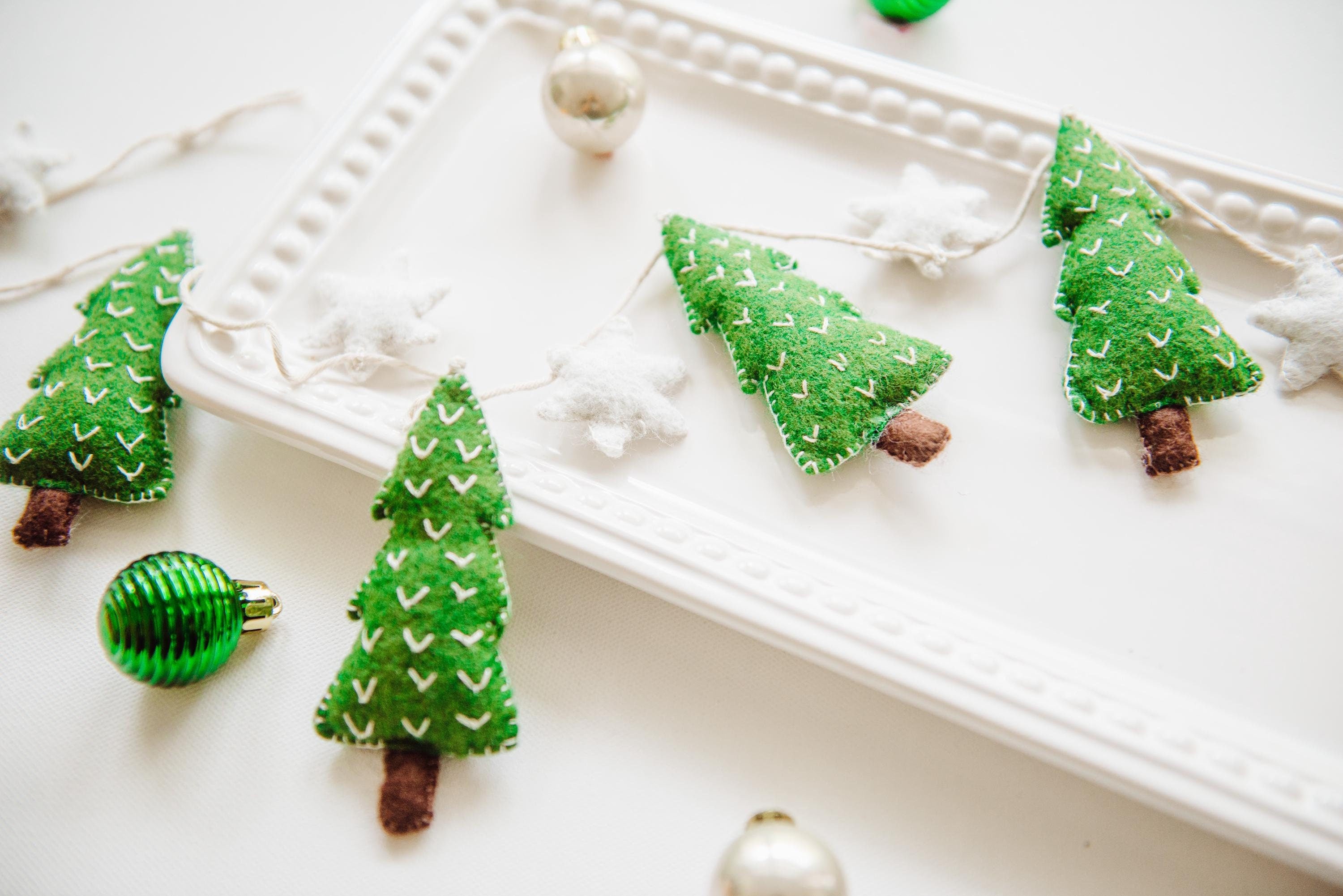 Felt Christmas Garland featuring tiny green christmas trees and white stars. Perfect christmas garland for mantle.