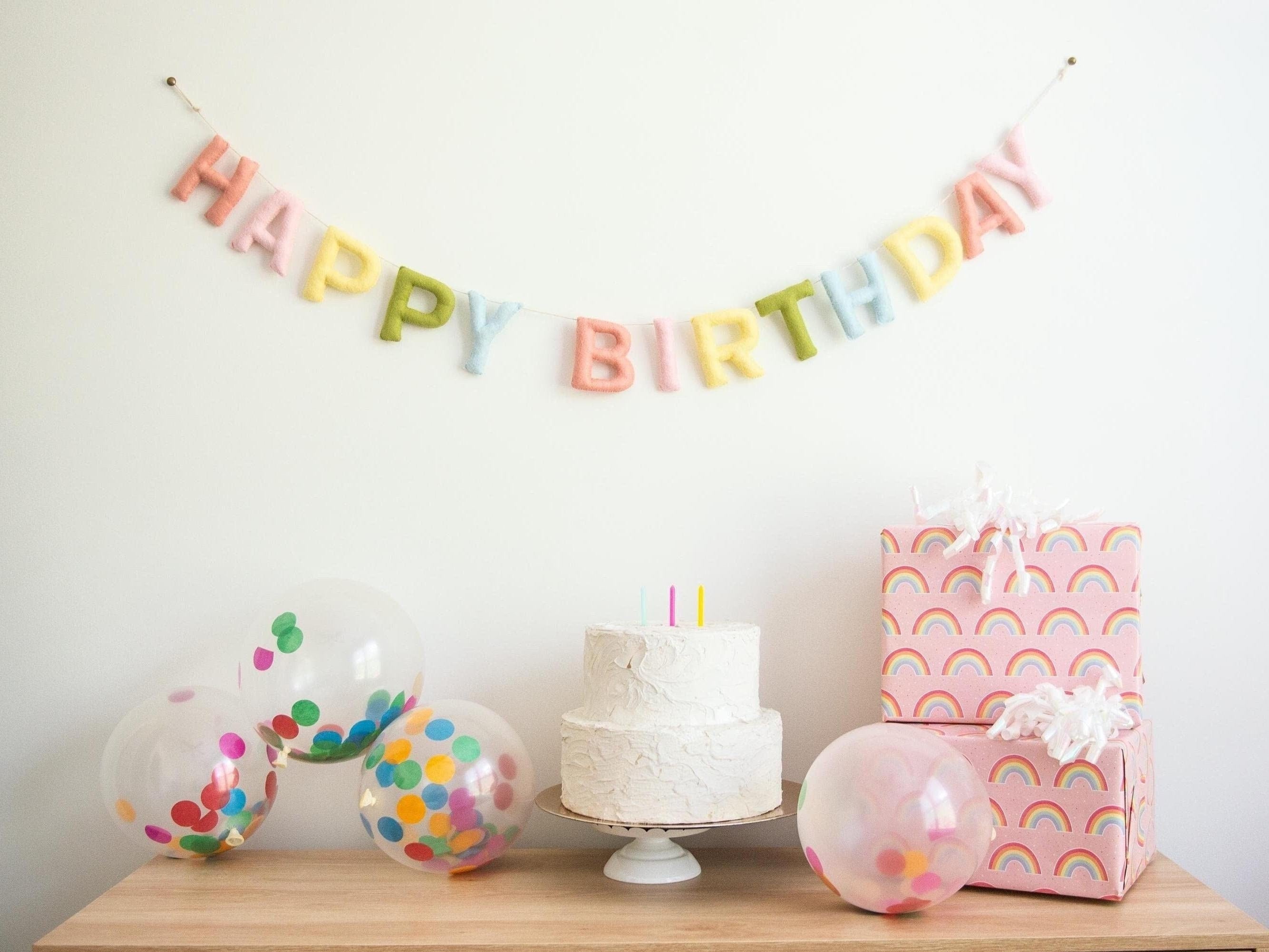 Felt Happy Birthday Banner in pastel rainbow colors. Perfect for a pastel rainbow party. This eco friendly garland is a sustainable choice for your birthday decorations.